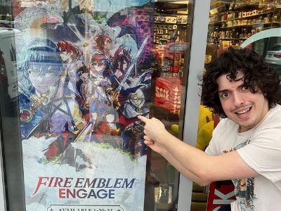 Nick Wolfhard is pointing to the Fire Emblem poster.